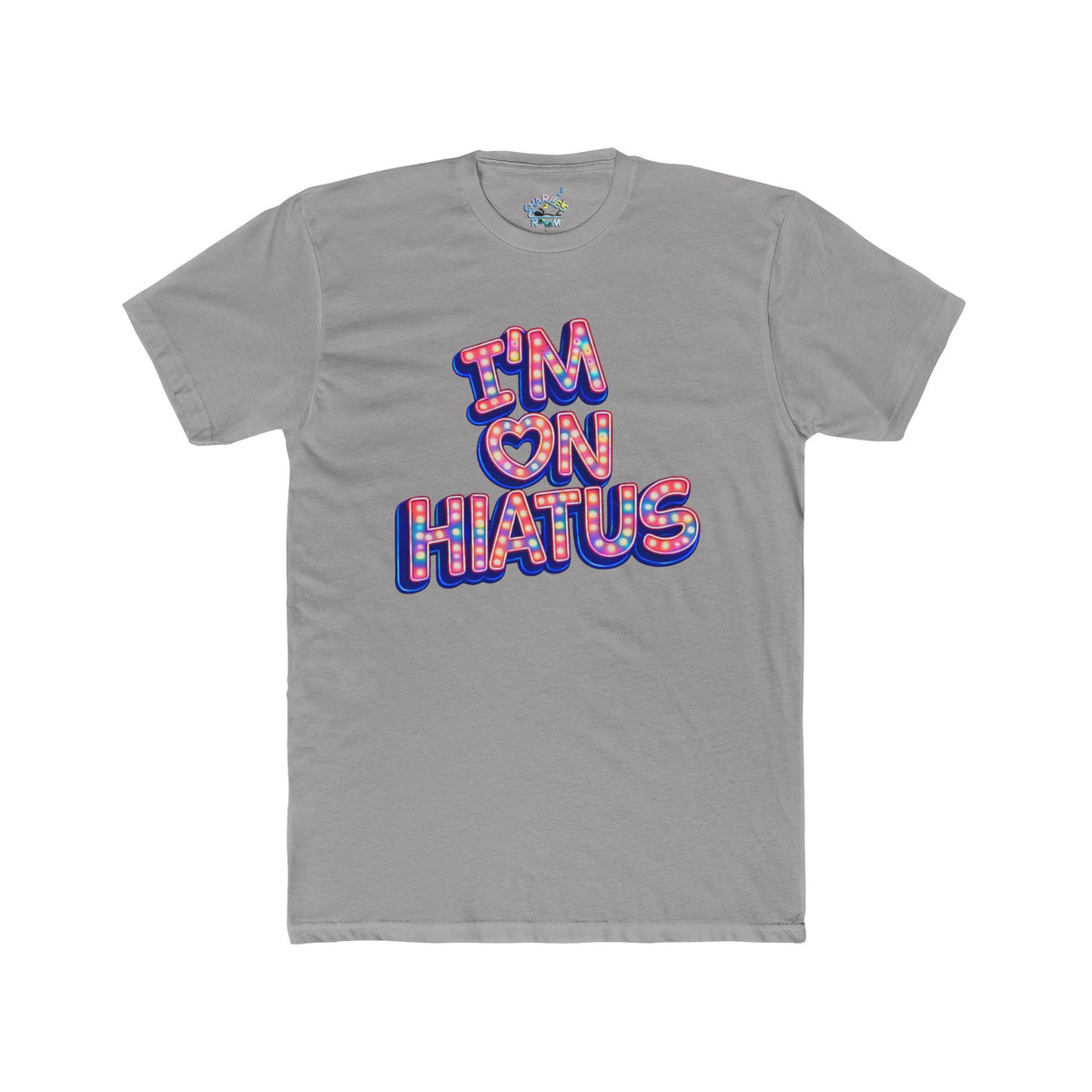 A gray short-sleeve crewneck t-shirt featuring a graphic text print that reads 'I'M ON HIATUS' in a 3D block font filled with a red, white, pink, and blue pattern and outlined in blue.